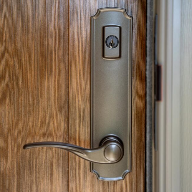 Trilennium® Eclipse Entry Door Hardware in Flat Bronze on a ProVia® entry door