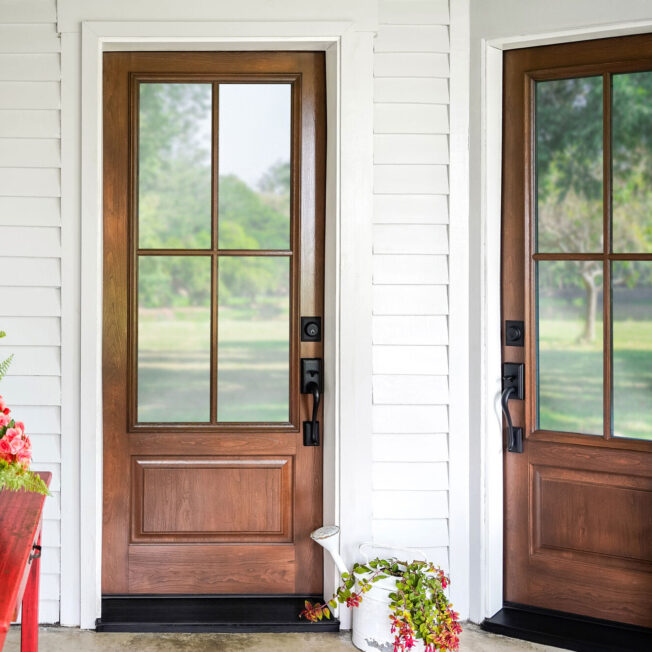 Exterior view of two ProVia® Signet® Cherry 440-1P Entry Doors in Nutmeg with Simulated Divided Lites
