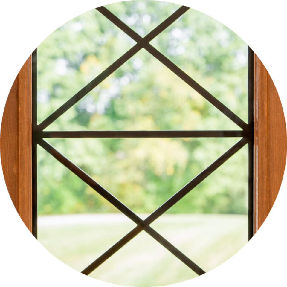 Small circle selector image showing Crossbuck wrought iron glass design, which can be used in ProVia® entry doors