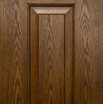Closeup image of ProVia® Ascent™ fiberglass entry door with White Oak skin and traditional embossing