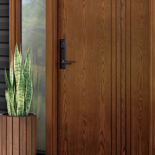 Closeup of a ProVia® Ascent™ White Oak 001-INS5N inscribed entry door in Aged Barrel