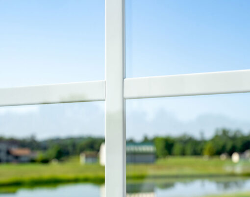 Closeup view of white flat entry door grids