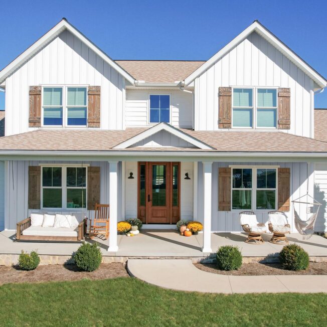 Image of a 2-story home featuring ProVia® CedarMAX®12-Inch Board and Batten in White