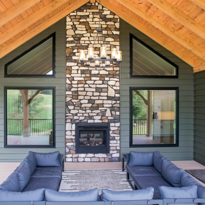 Exterior view of an outdoor fireplace featuring ProVia® Ridge Cut™ Denali Manufactured Stone