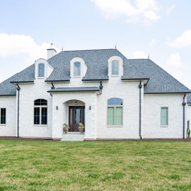Exterior view of a home featuring ProVia® Thin Brick Delaware Manufactured Stone