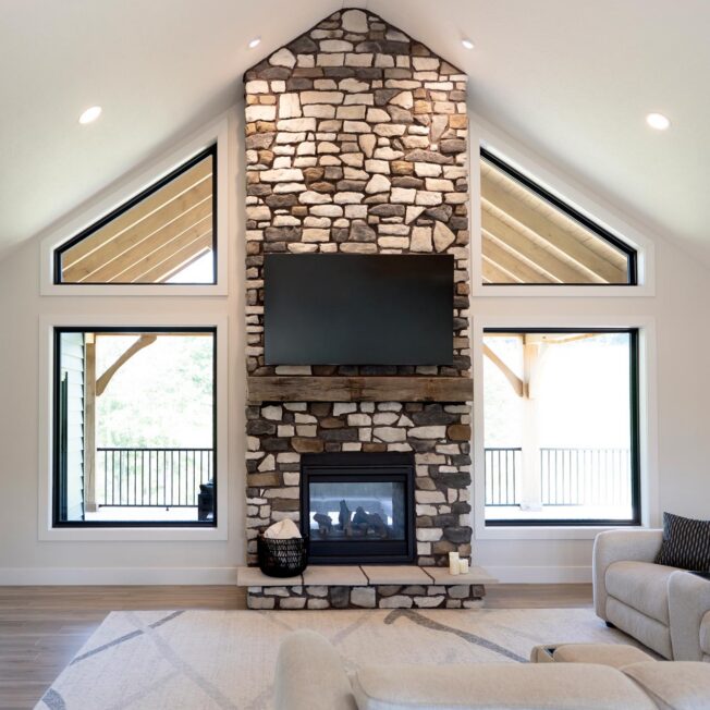 Interior view of a fireplace featuring ProVia® Ridge Cut™ Denali Manufactured Stone