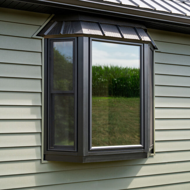 Exterior view of a ProVia® Endure™ Bay Window in the color Textured Matte Coal Black