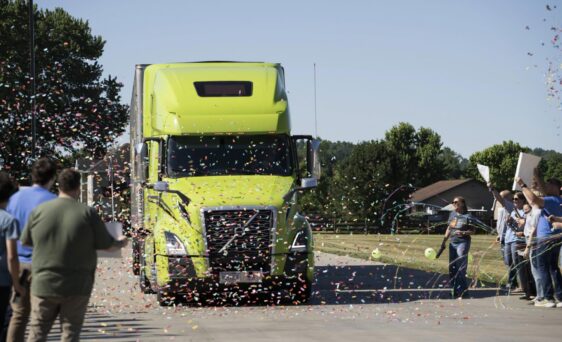 Employees and family of a ProVia® truck driver celebrate his Million Mile Club induction with confetti as his truck pulls in to a ProVia facility.