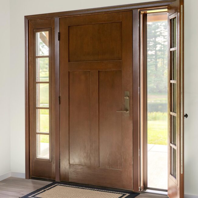 Interior view of a ProVia® Signet® Fir 003C Entry Door and Venting Sidelite with Screen in Truffle