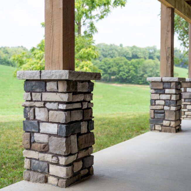 Exterior view of porch columns with ProVia® Terra Cut™ Niagara Manufactured Stone