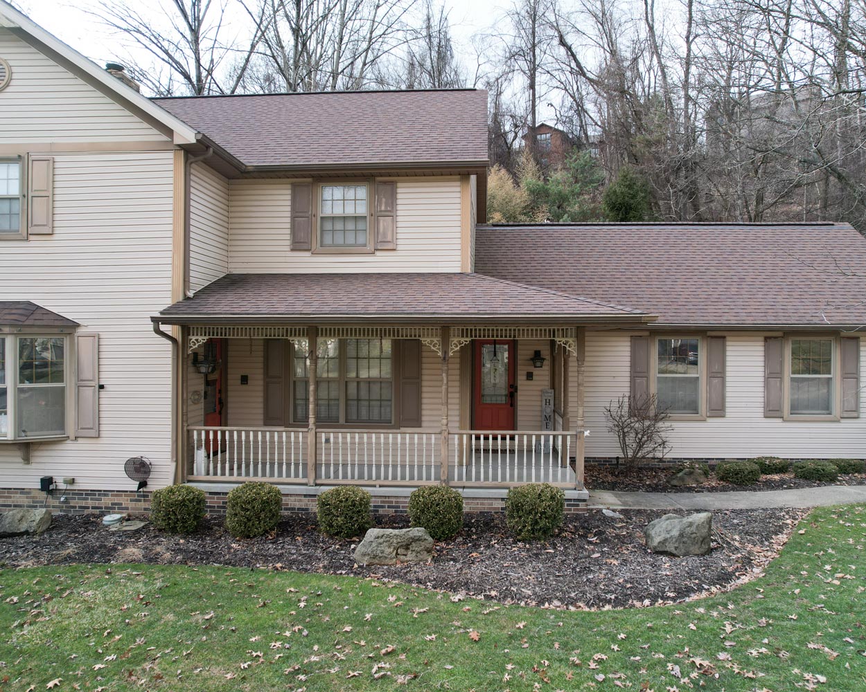 Exterior view of the front of a home before a home exterior remodel