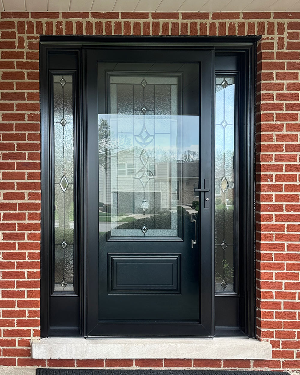 Exterior view of a ProVia® Decorator™ 590 Storm Door in Coal Black