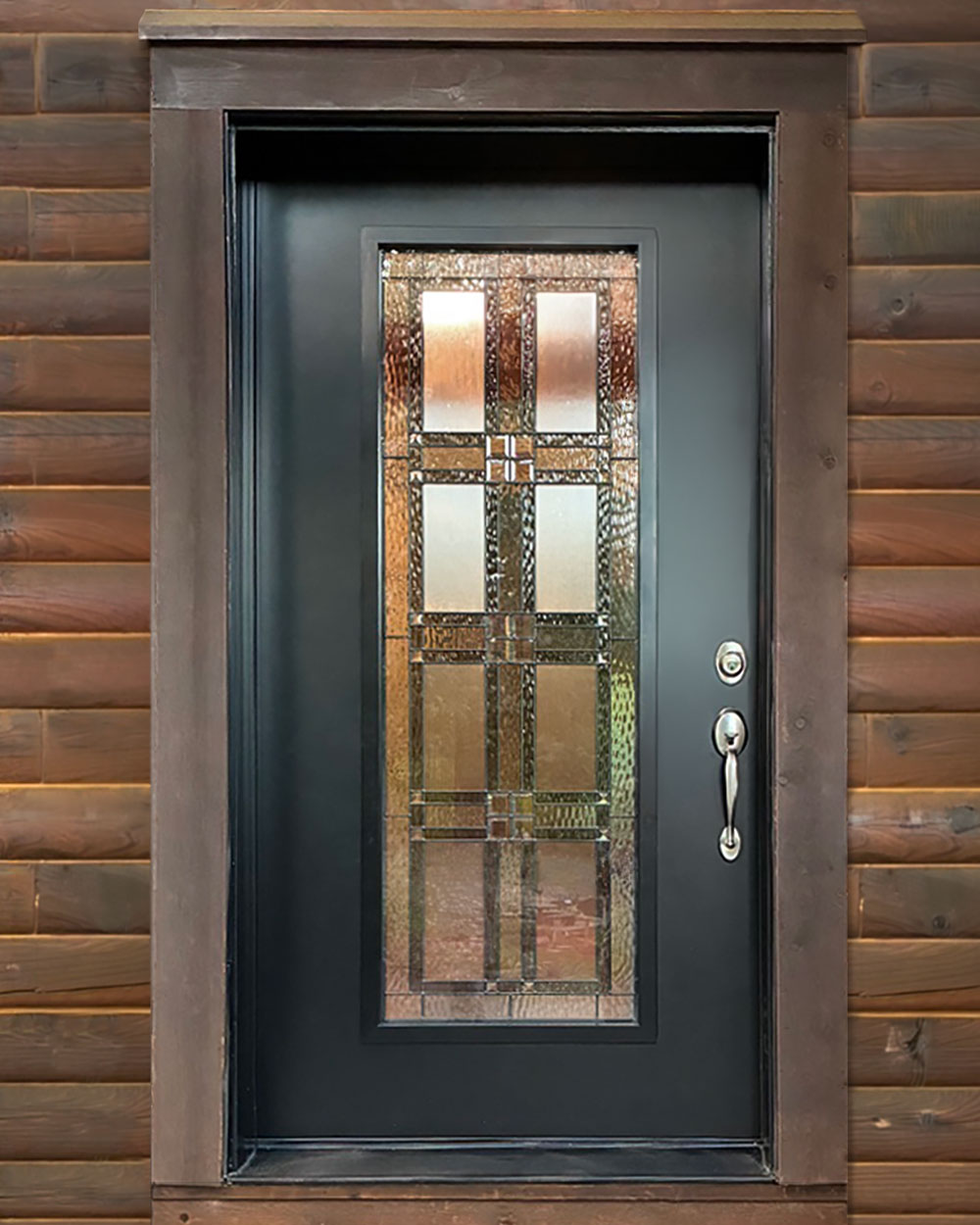 Exterior closeup view of a log home with a ProVia® Signet® Smooth 460 Entry Door in Coal Black with Laurence Decorative Glass